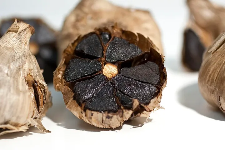 Studio macro photograph of black garlic