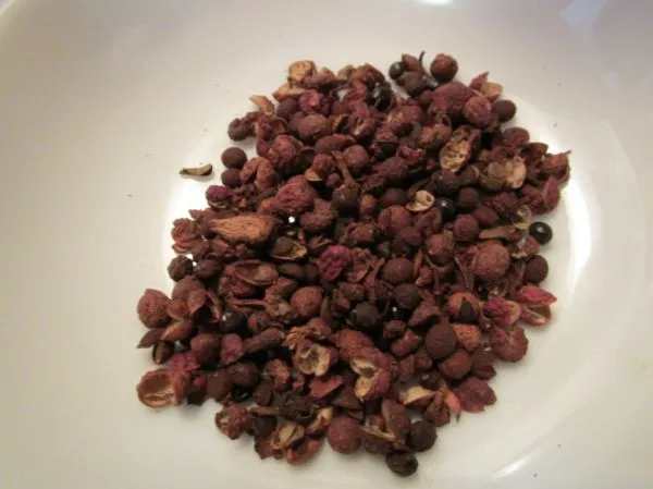Studio macro photograph of sichuan peppercorns