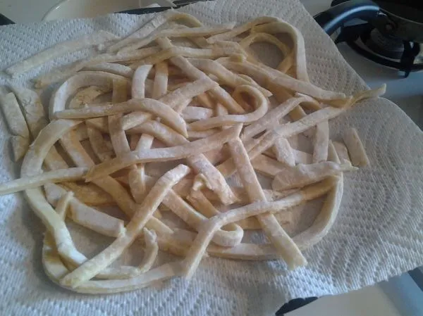 Studio macro photograph of wide egg noodles